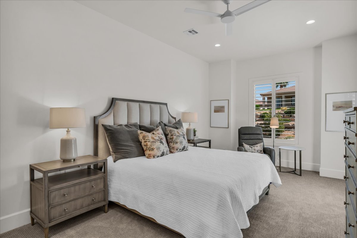 Spacious room featuring neutral carpeting and white walls