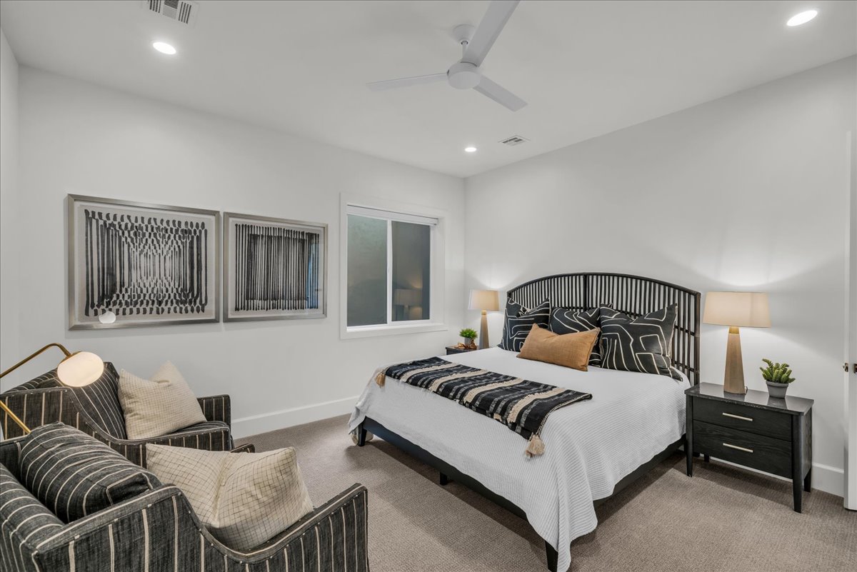 Bedroom featuring a window, recessed lighting, and a ceiling fan