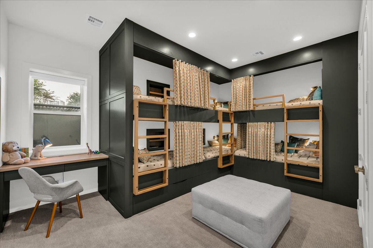 Built-in bunk bed system with integrated ladders and privacy curtains