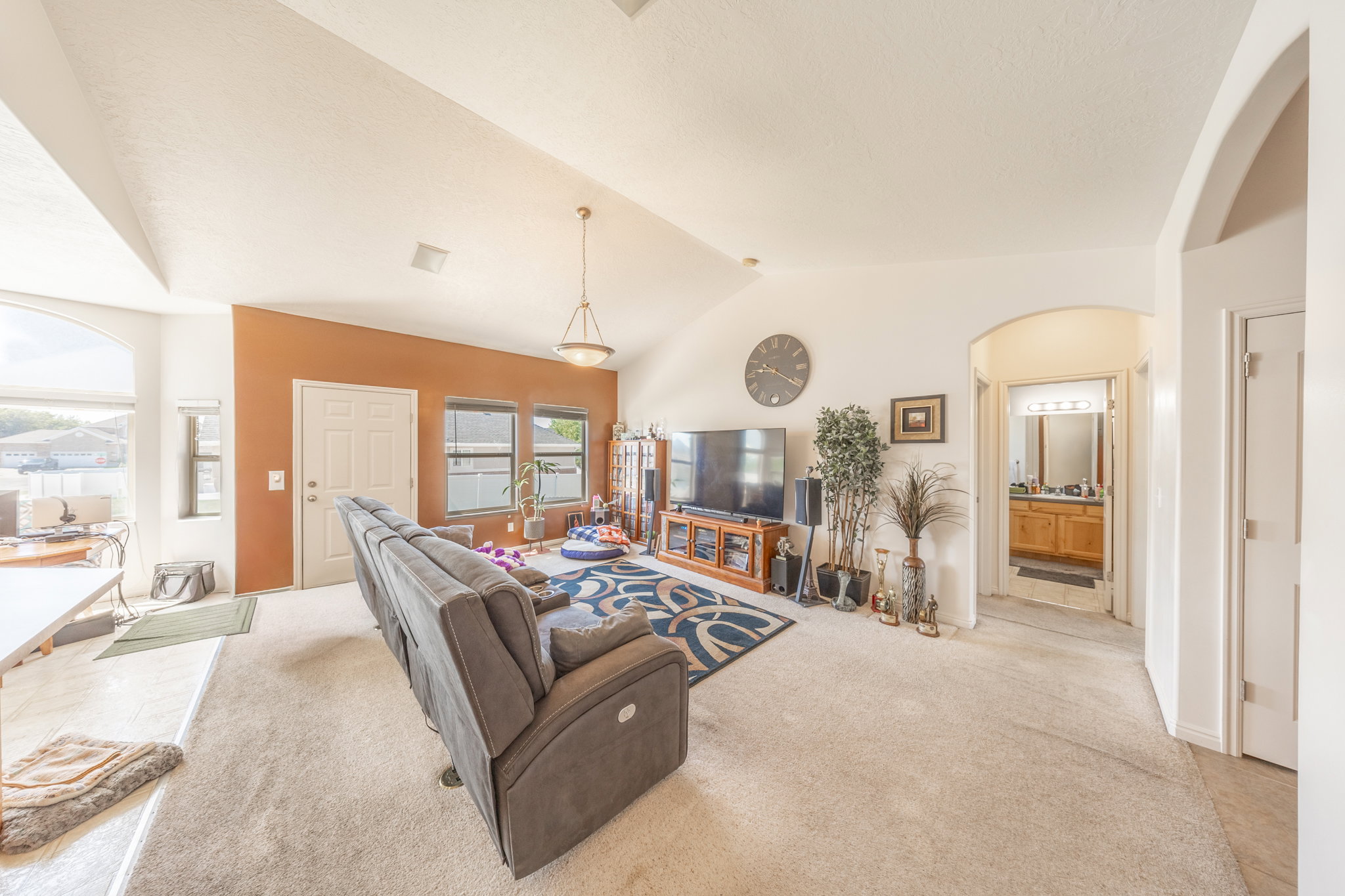 Open family room with vaulted ceilings