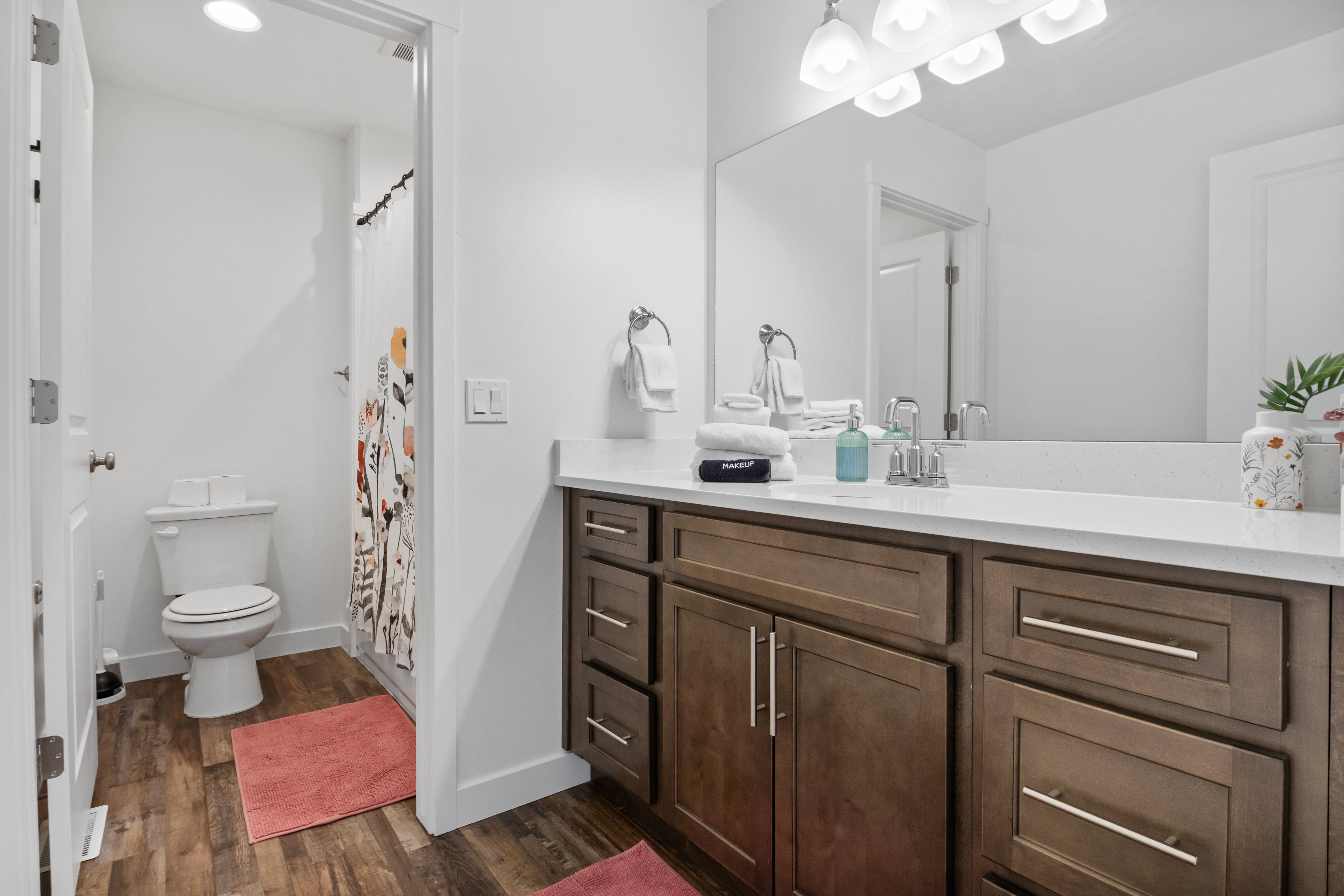 Spacious vanity with a white countertop and double-door cabinetry