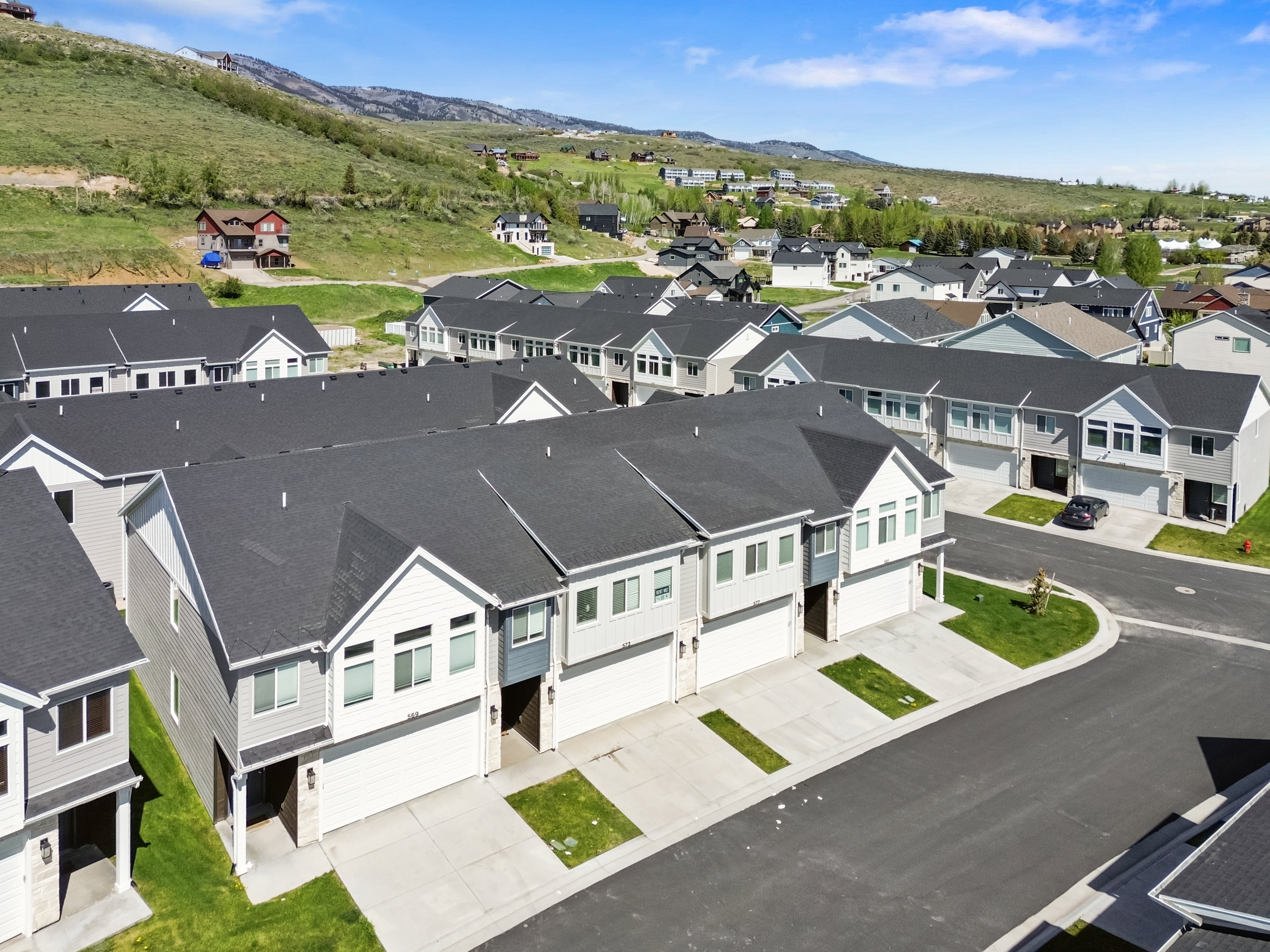 Contemporary townhome community with a mountainous backdrop