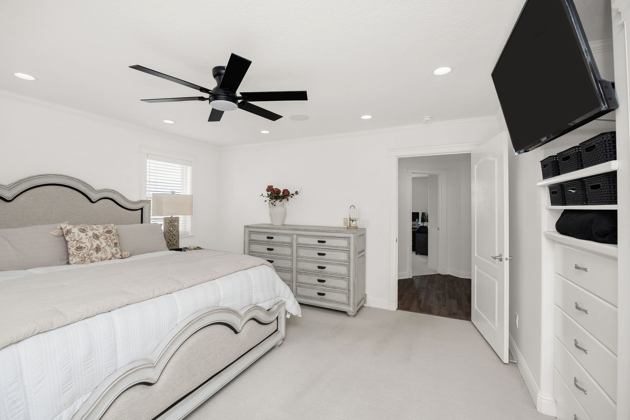 Bedroom featuring light-toned carpet flooring and recessed lighting