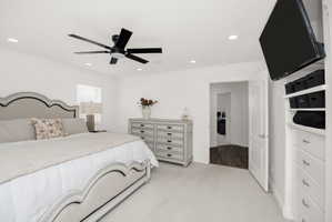 Bedroom featuring light-toned carpet flooring and recessed lighting