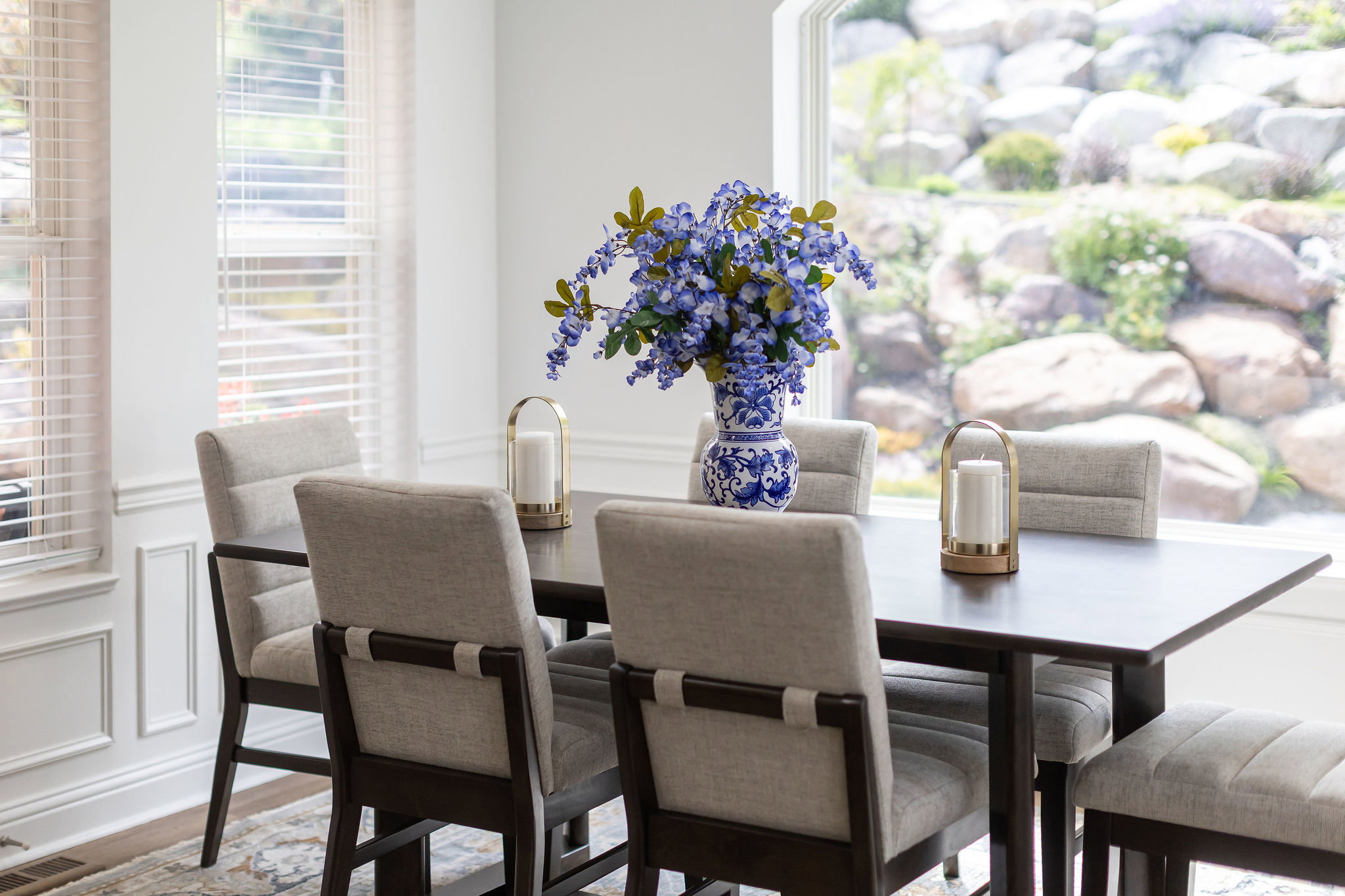 Bright interior space with white paneled walls and multiple windows