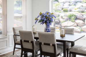 Bright interior space with white paneled walls and multiple windows