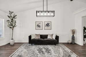 Vaulted ceiling featuring a linear pendant light fixture