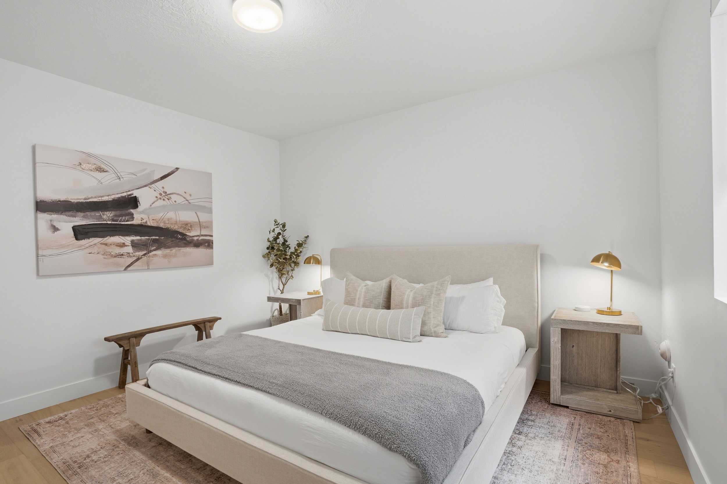 Bright room featuring light wood-finish flooring and white walls