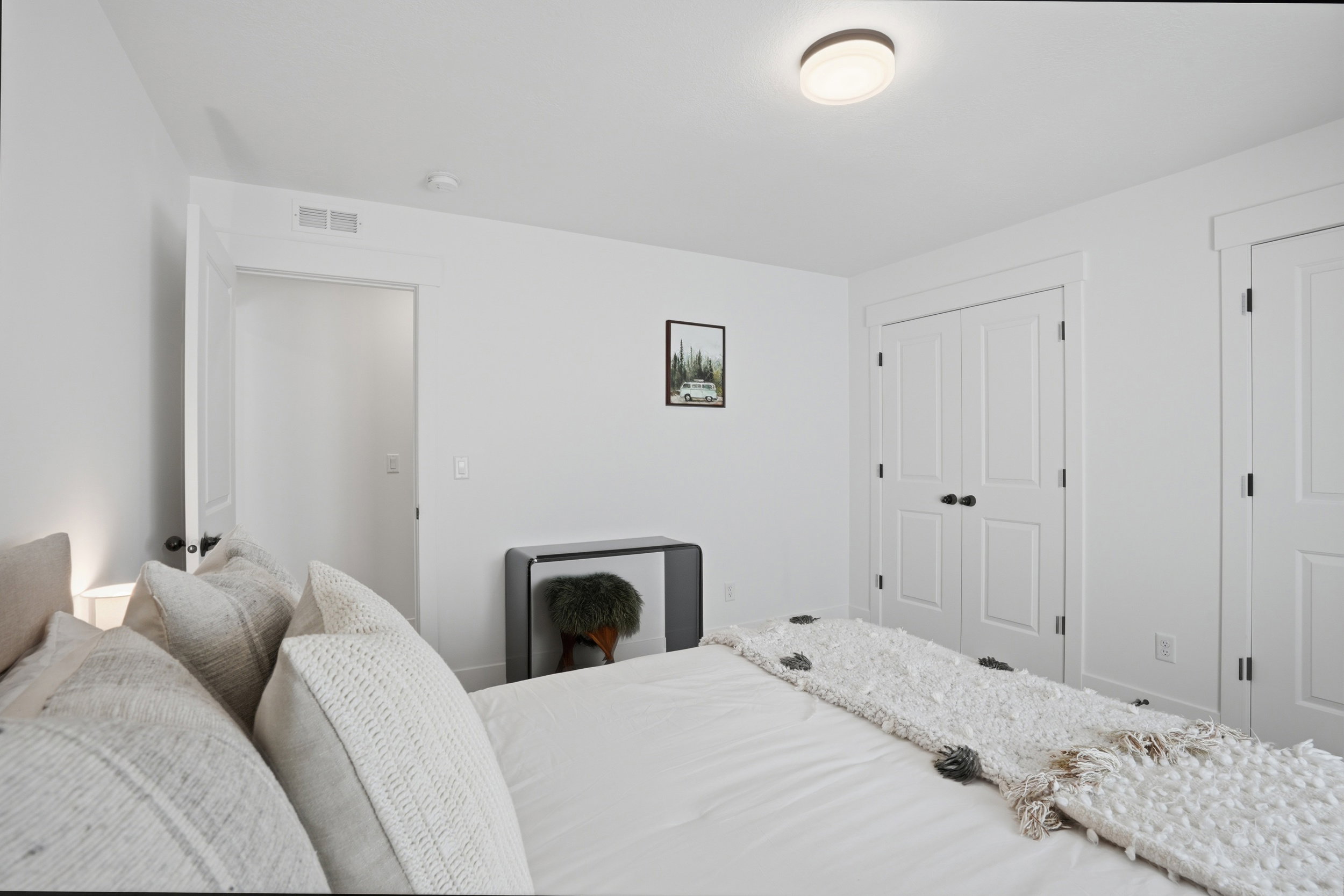 White walls with matching trim and doors provide a bright interior