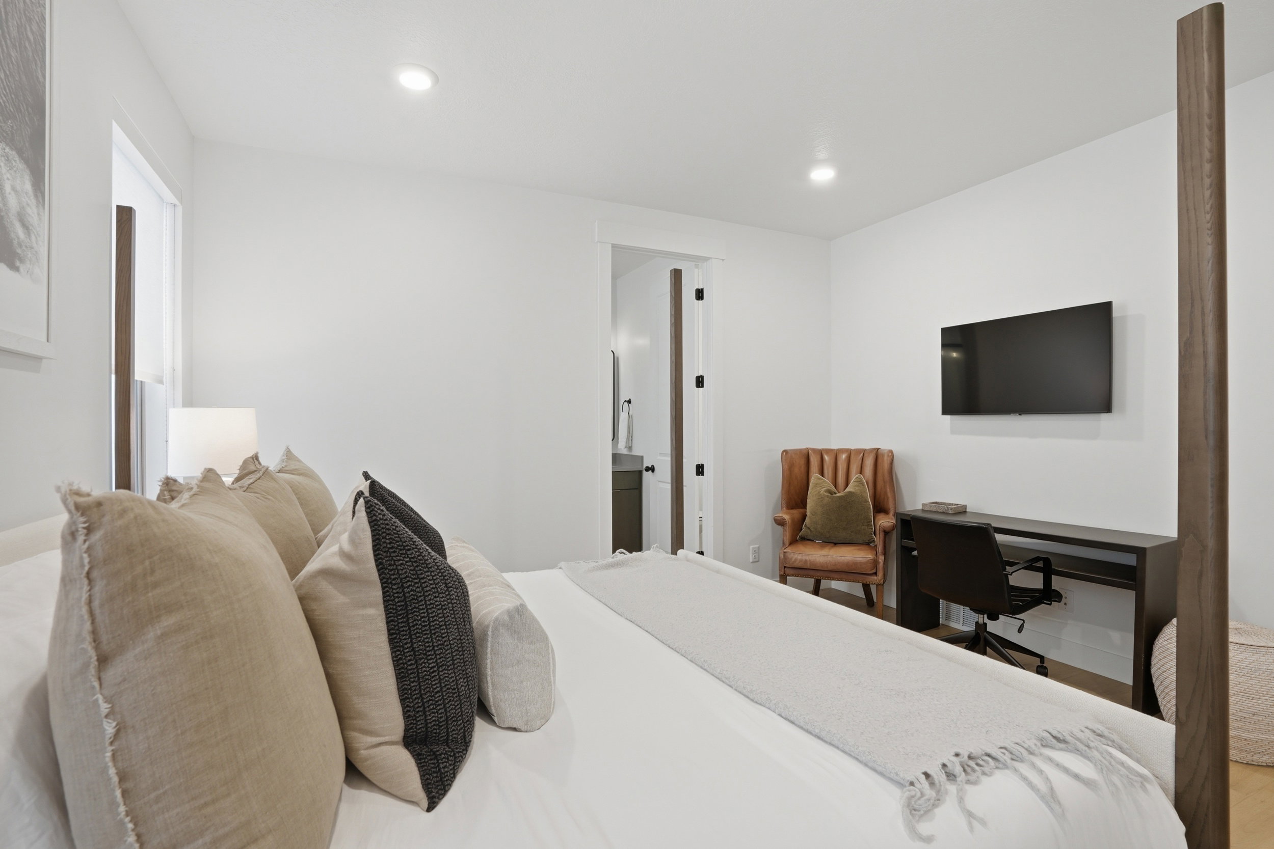 Bright interior space with recessed lighting and neutral wall finishes