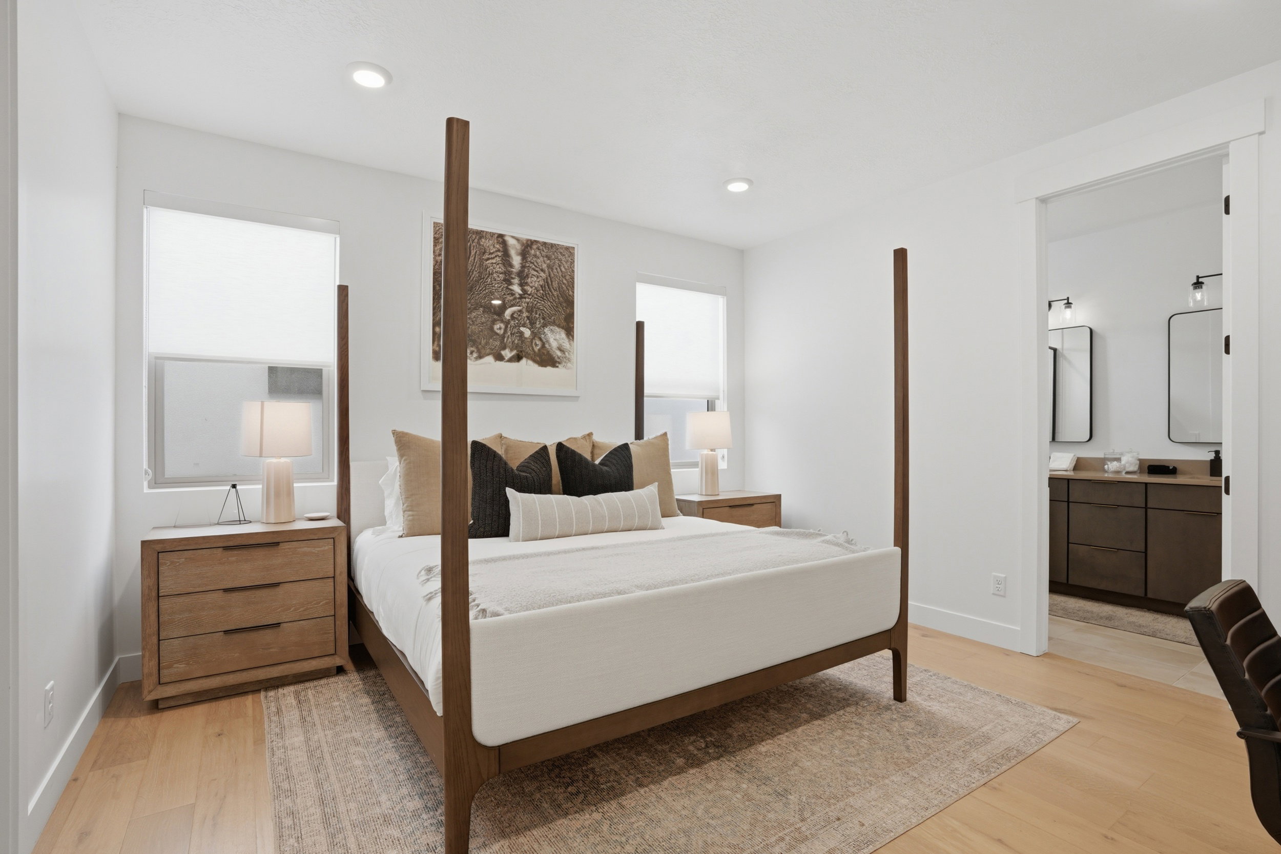 Bright bedroom featuring recessed lighting and light wood-finish flooring