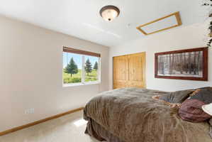 Double window framing a pastoral landscape