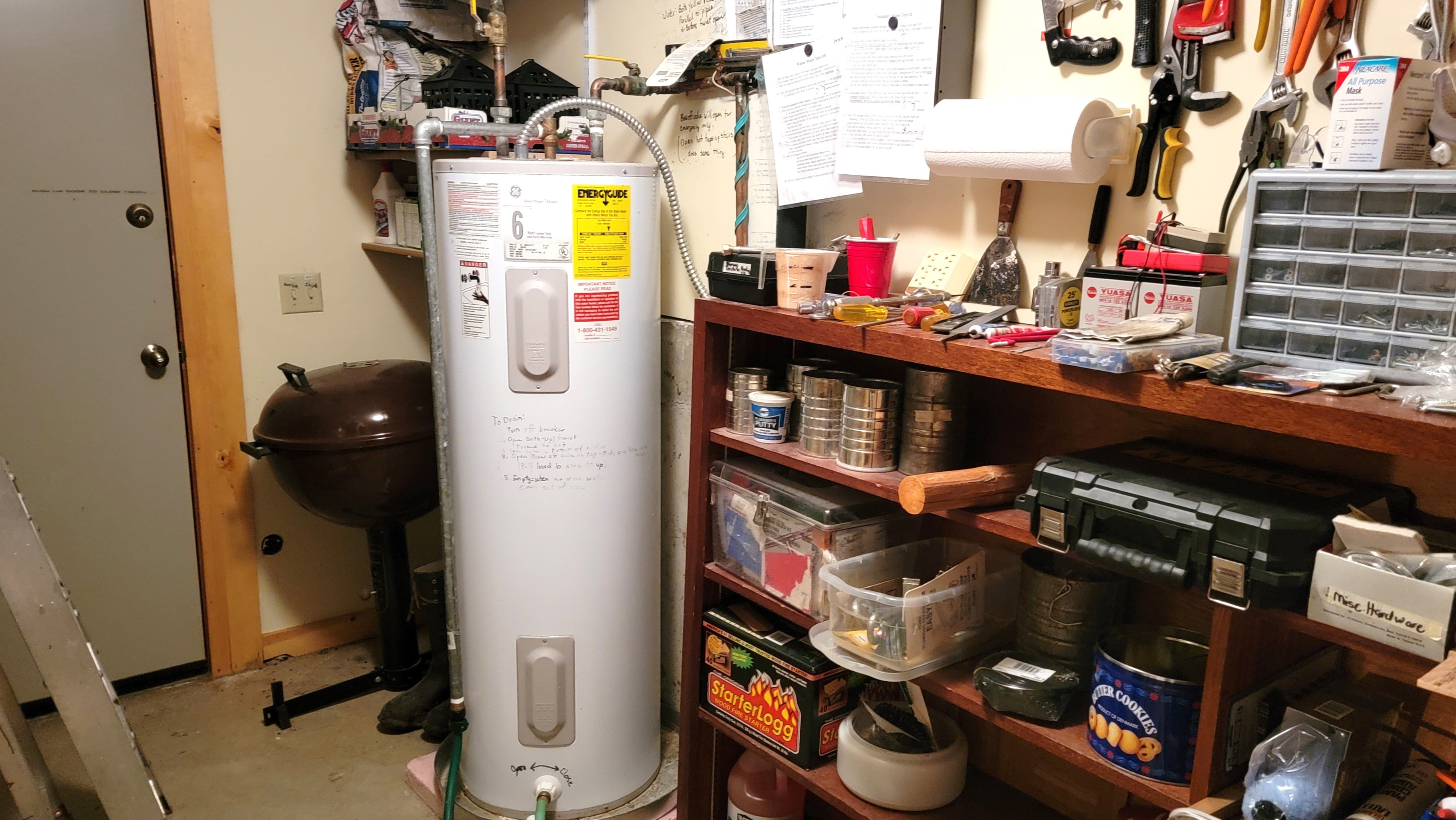 50 Gallon water heater in the utility room and a second door to the back of the cabin. The basement concrete slab floor is a big upgrade from a crawlspace.