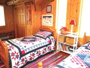 Loft bedroom with large closet and baseboard heating. The twin beds convert to bunk beds.