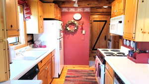 Kitchen view 2: Kitchen and laundry/mud room& back door.