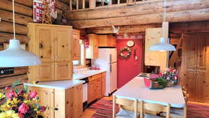 Galley kitchen and breakfast bar.