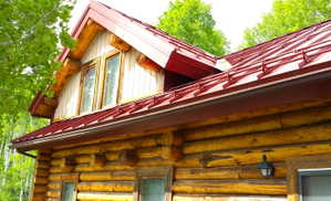 The cabin has a newer red heavy duty standing steel roof, with and heavily engineered snow guards for safety, to keep snow from sliding off the roof.