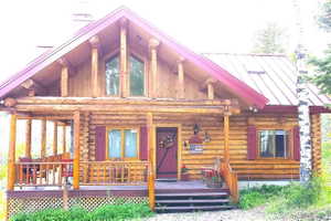 Architectural log beams and supports are throughout the cabin. Clerestory windows in the vaults on the east and south side of the cabin illuminate the interior.