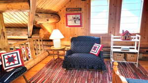 Sitting area of the loft with a rocking love seat. Perfect for bedtime stories and lullabies.