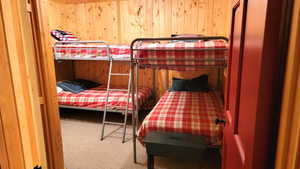 The lower level bunk room with 2 sets of twin beds. Bunk room has no window. There are 2 outside exit doors close by in the family room and the utility room.