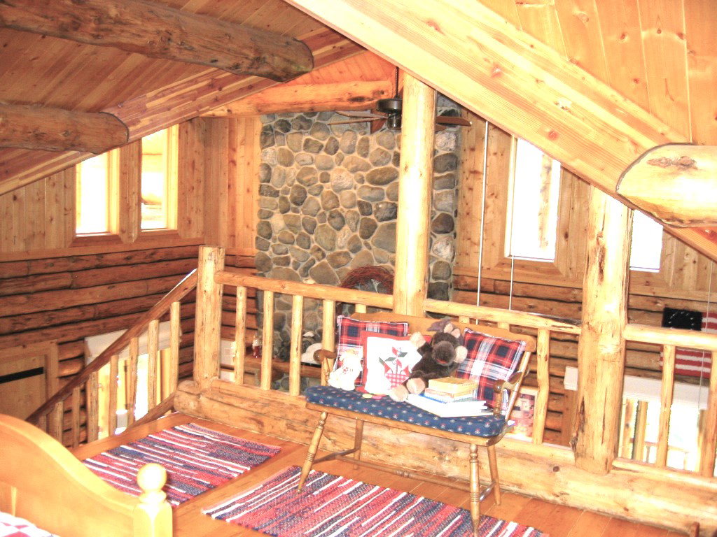 Loft overlook to the main floor. Clerestory windows add views and sunlight on both levels.