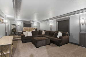 Large theater room featuring, recessed lighting, wall sconces, full projection and sound system