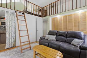 Lofted sleeping area with wood railing