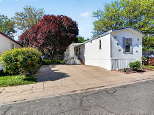 White exterior with blue window shutters