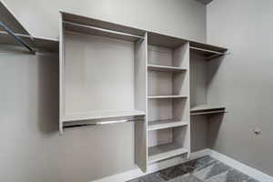 Built-in closet system featuring multiple hanging rods and shelving units