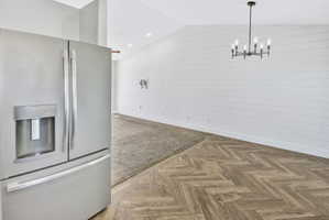 Vaulted ceilings complement the white shiplap wall paneling