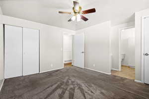 Spacious room featuring neutral carpeting and light gray walls