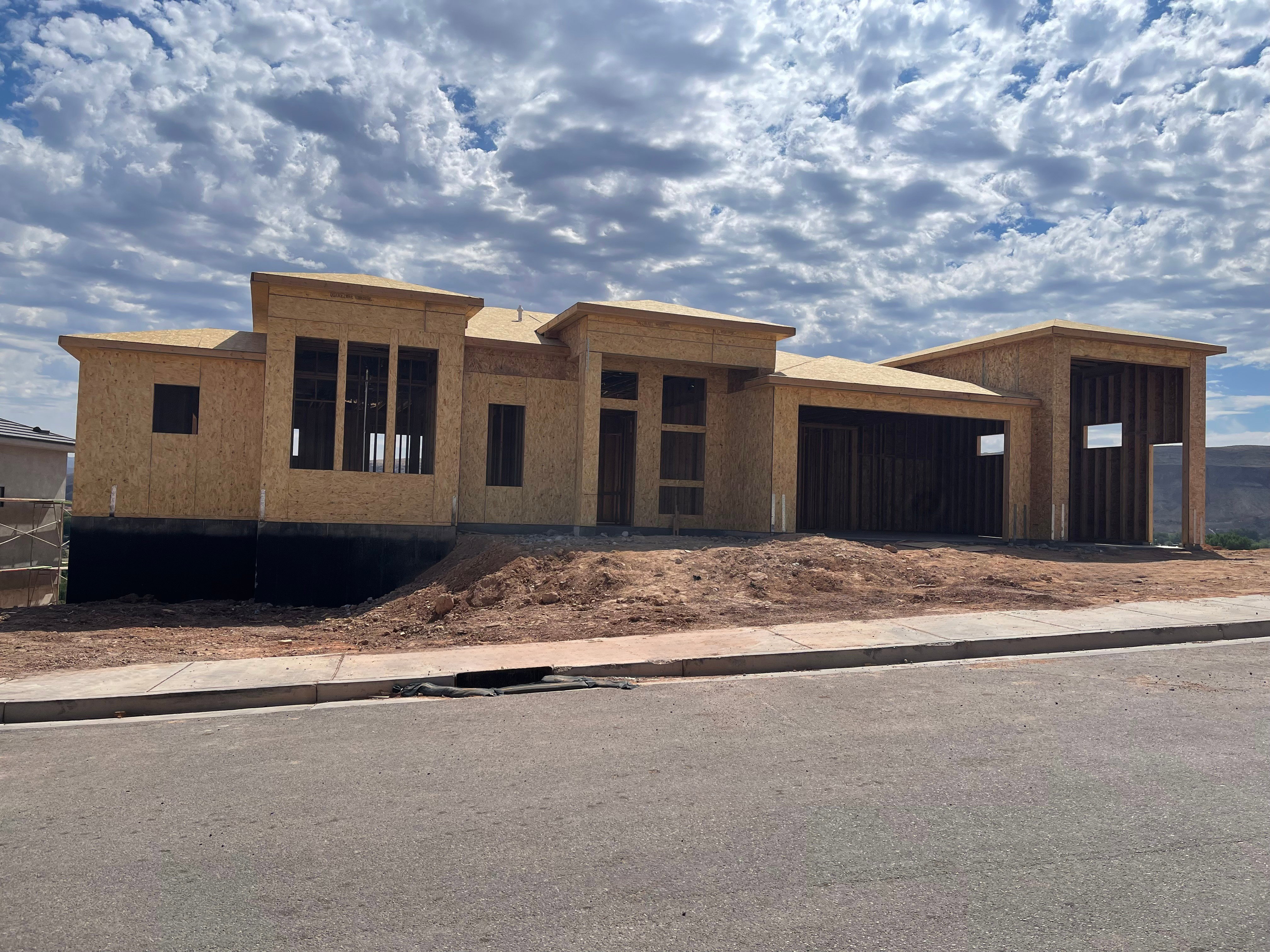 Contemporary architectural design featuring a flat roofline and multiple window openings
