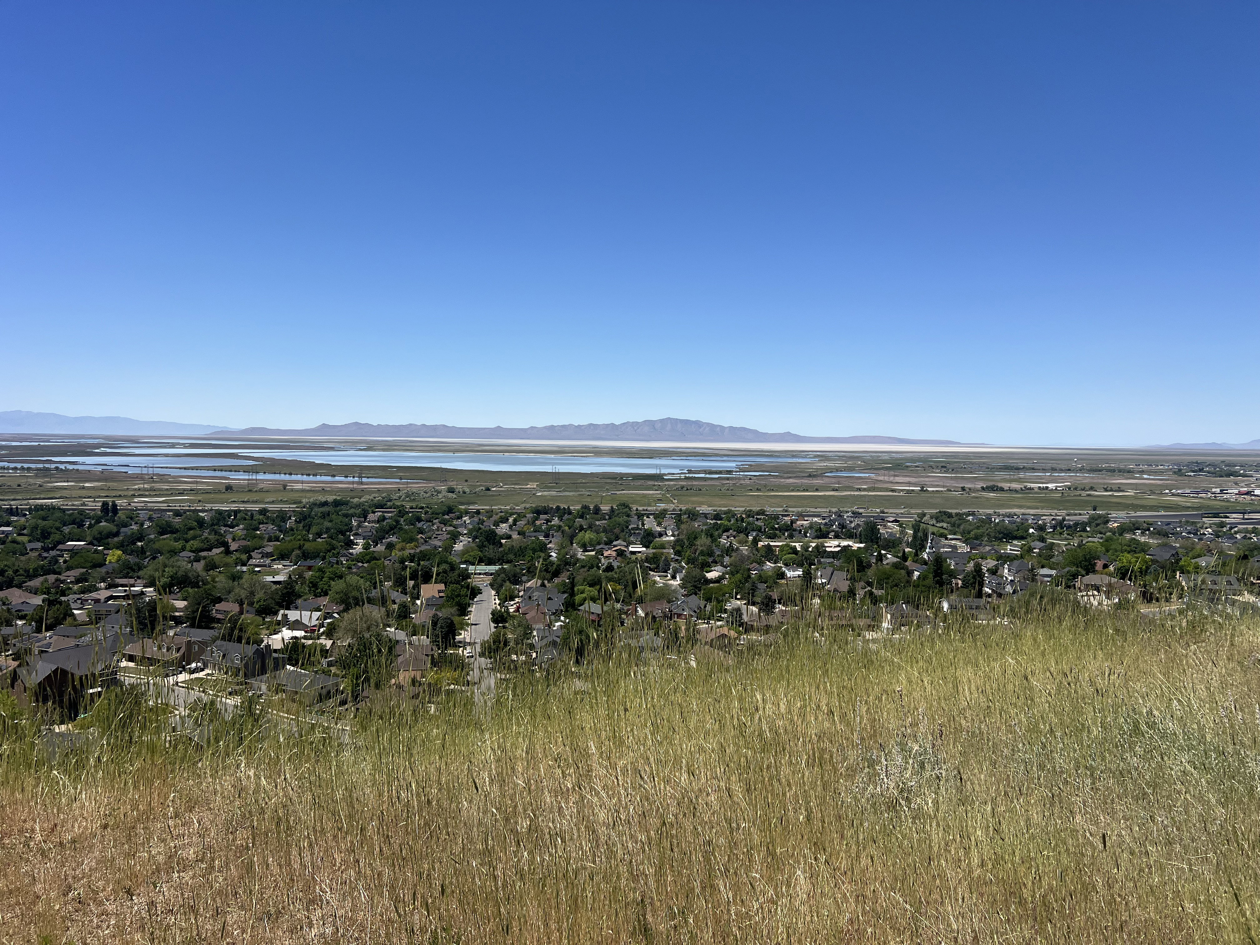 Expansive horizon featuring a body of water and distant mountains