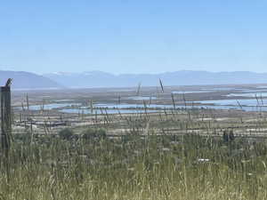 Expansive mountain and lake scenery with distant water bodies and a clear horizon