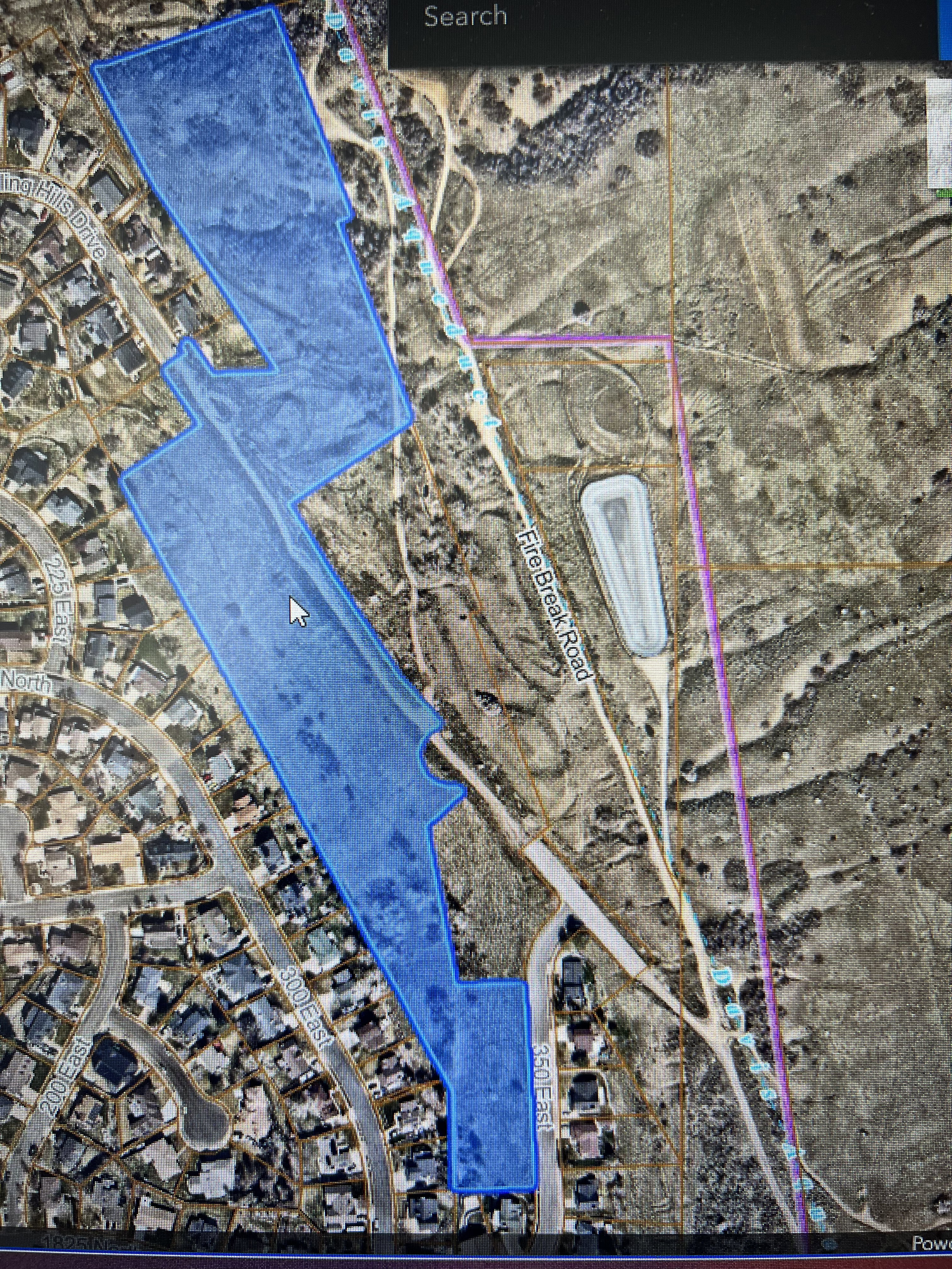 Property Map. Displaying the property's boundaries overlaid on an aerial image and showing surrounding roads and structures
