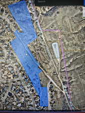 Property Map. Displaying the property's boundaries overlaid on an aerial image and showing surrounding roads and structures
