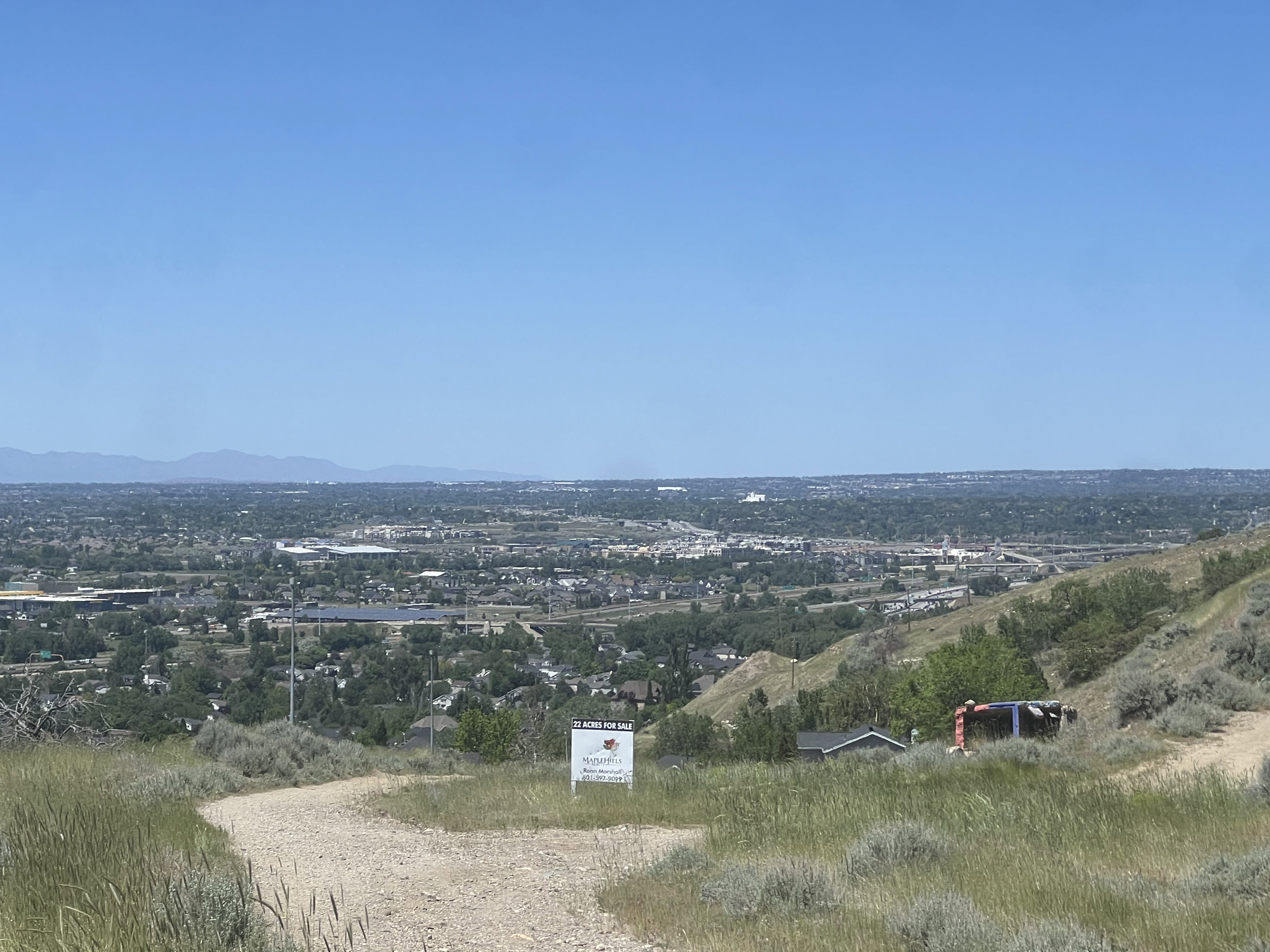 Expansive land parcel featuring natural terrain and distant city views