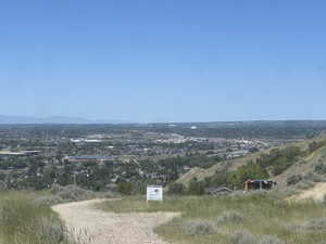 Expansive land parcel featuring natural terrain and distant city views