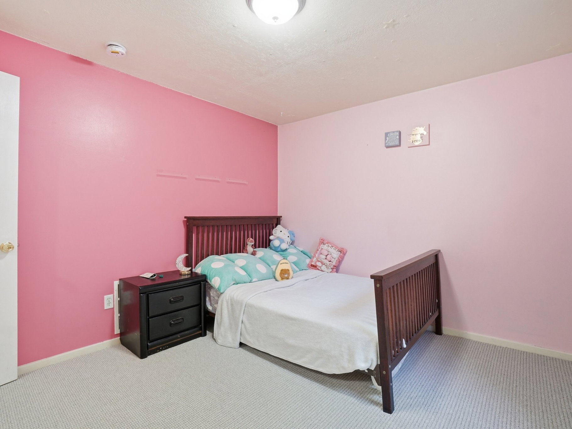 Wall-to-wall carpeting with a light neutral tone