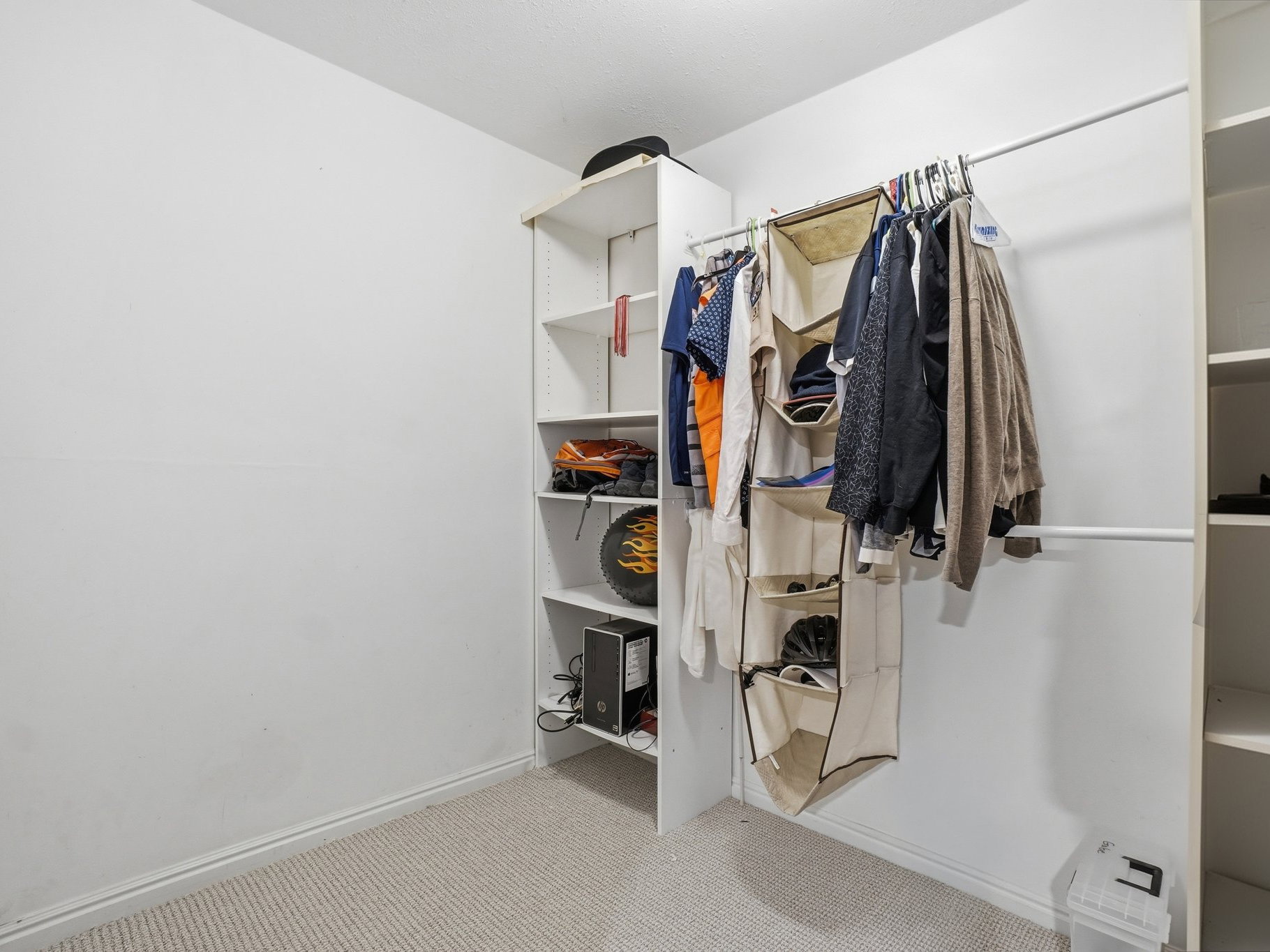 Built-in closet system featuring multiple shelving units and hanging rods