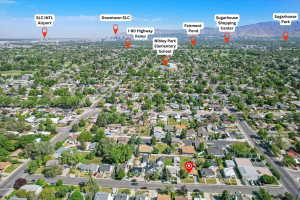 Aerial view showcasing a residential neighborhood with tree-lined streets
