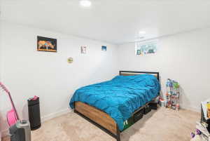 Spacious room with plush carpet flooring and clean white walls