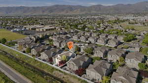 Aerial perspective showcasing a residential community with distant mountain ranges