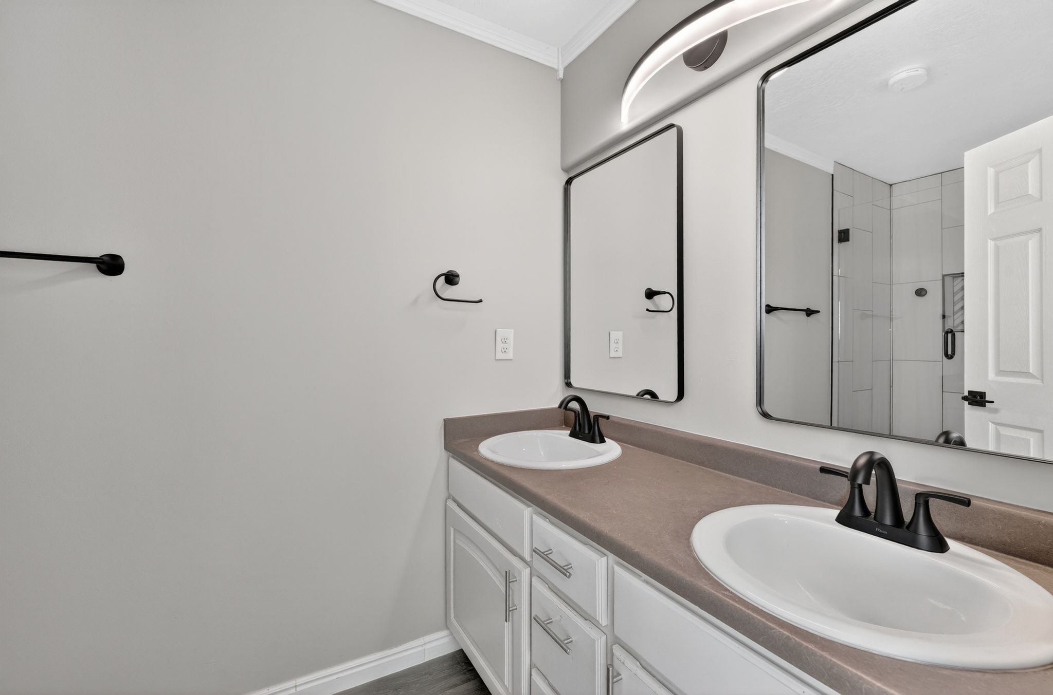 Dual vanity featuring undermount sinks and matte black fixtures