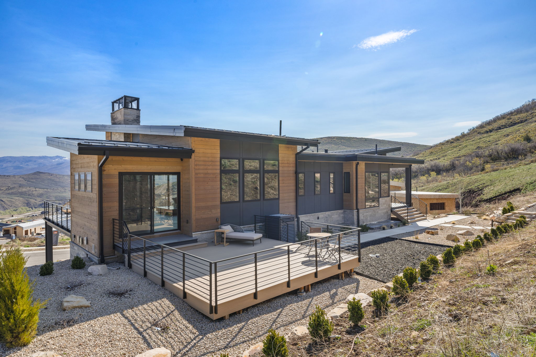 Contemporary exterior with wood-tone siding and dark panels