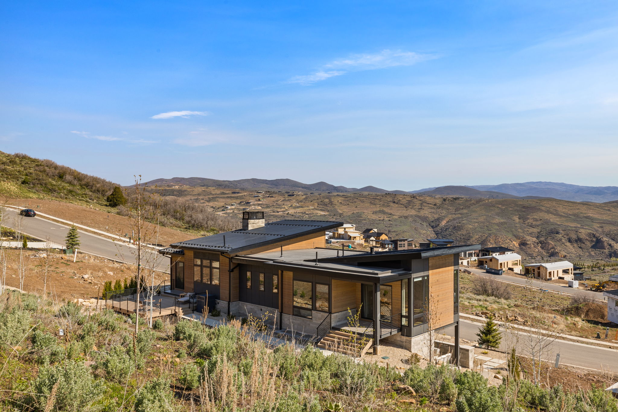 Contemporary architectural design featuring a flat roofline and extensive window placement