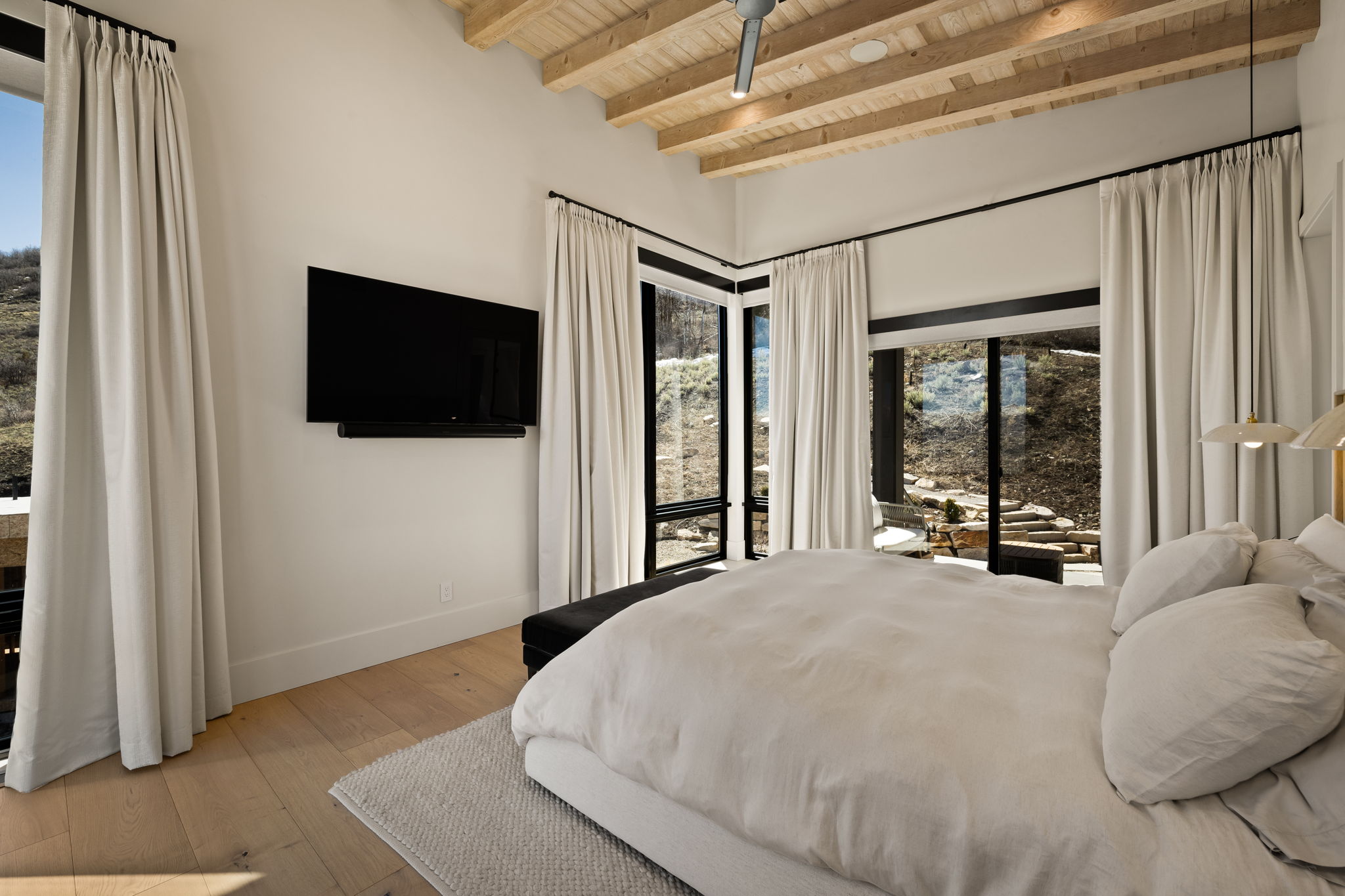 Vaulted timber-paneled ceiling with recessed lighting