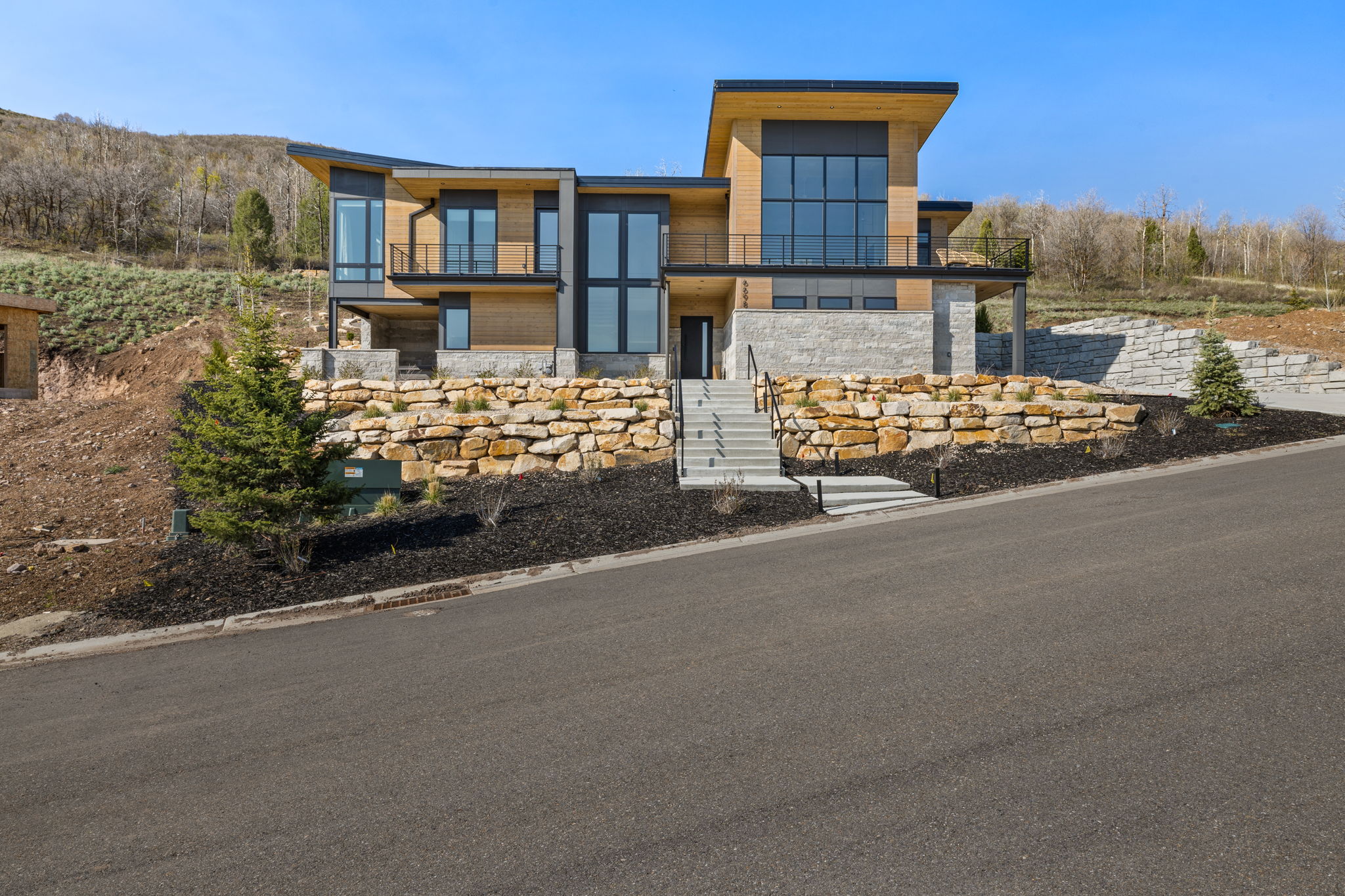Contemporary residence featuring a multi-level design with extensive glazing