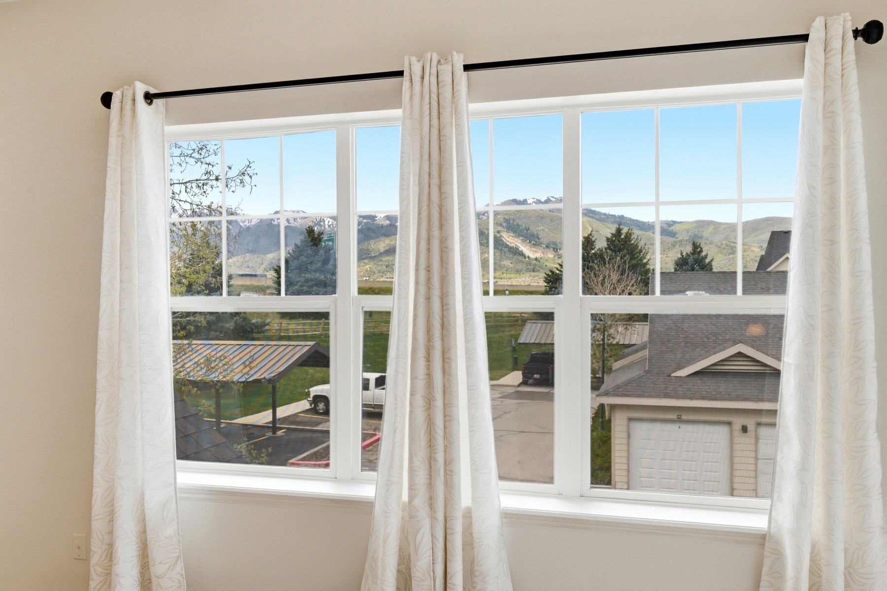 Expansive window with mountain scenery