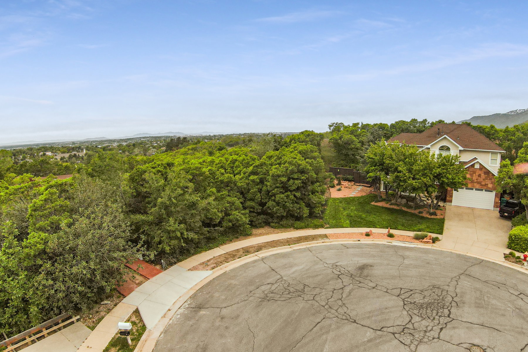 Cul-de-sac residence featuring a two-story design with a prominent front-facing gable